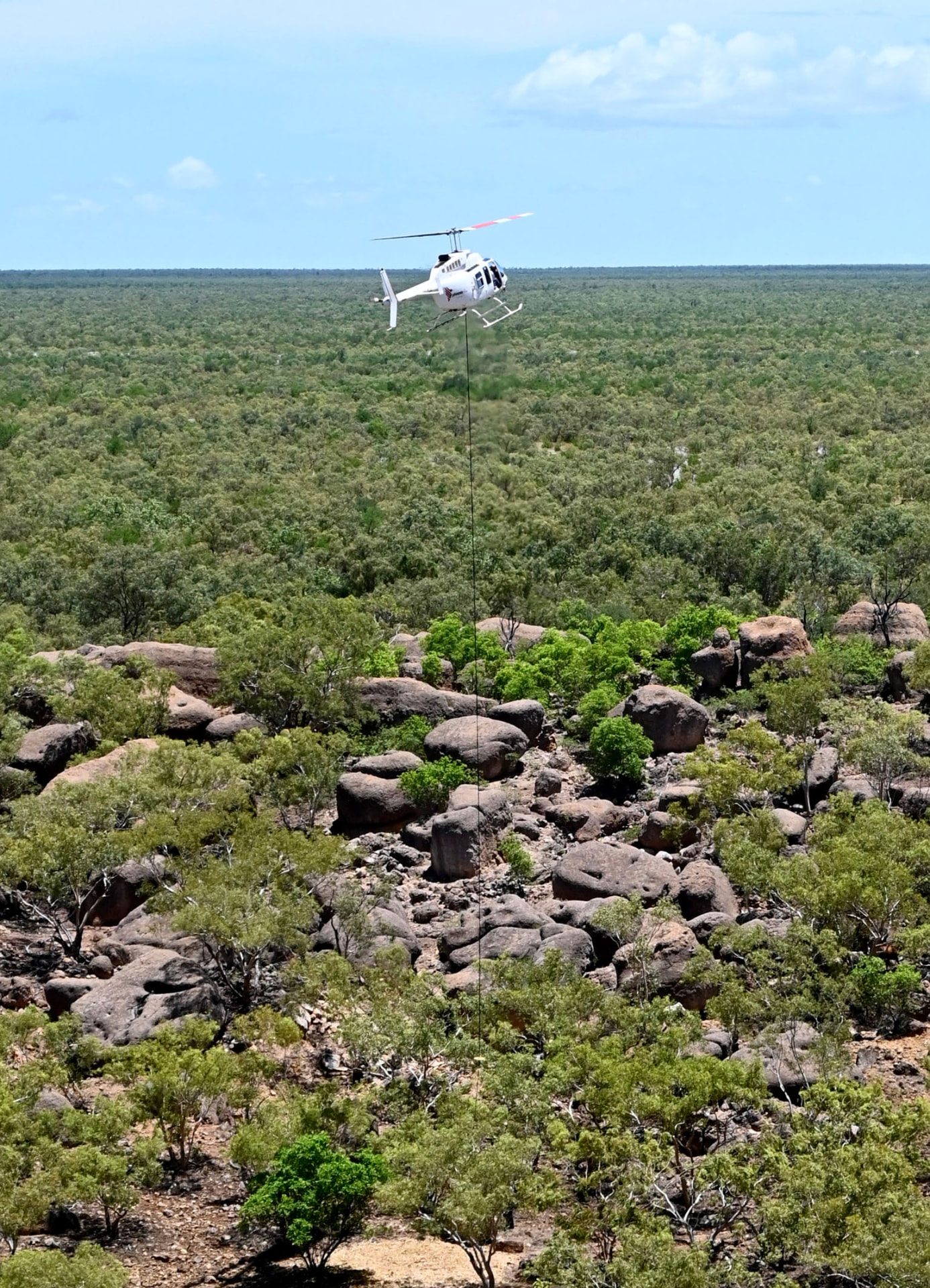 Engineer carrying out a maintenance inspection on a helicopter